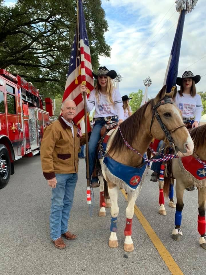 Katy Mayor Bill hastings poses with the Katy Cowgirls at a prior year's Katy Rice Festival Parade. The parade and the cowgirls have been a longstanding part of the festival tradition.